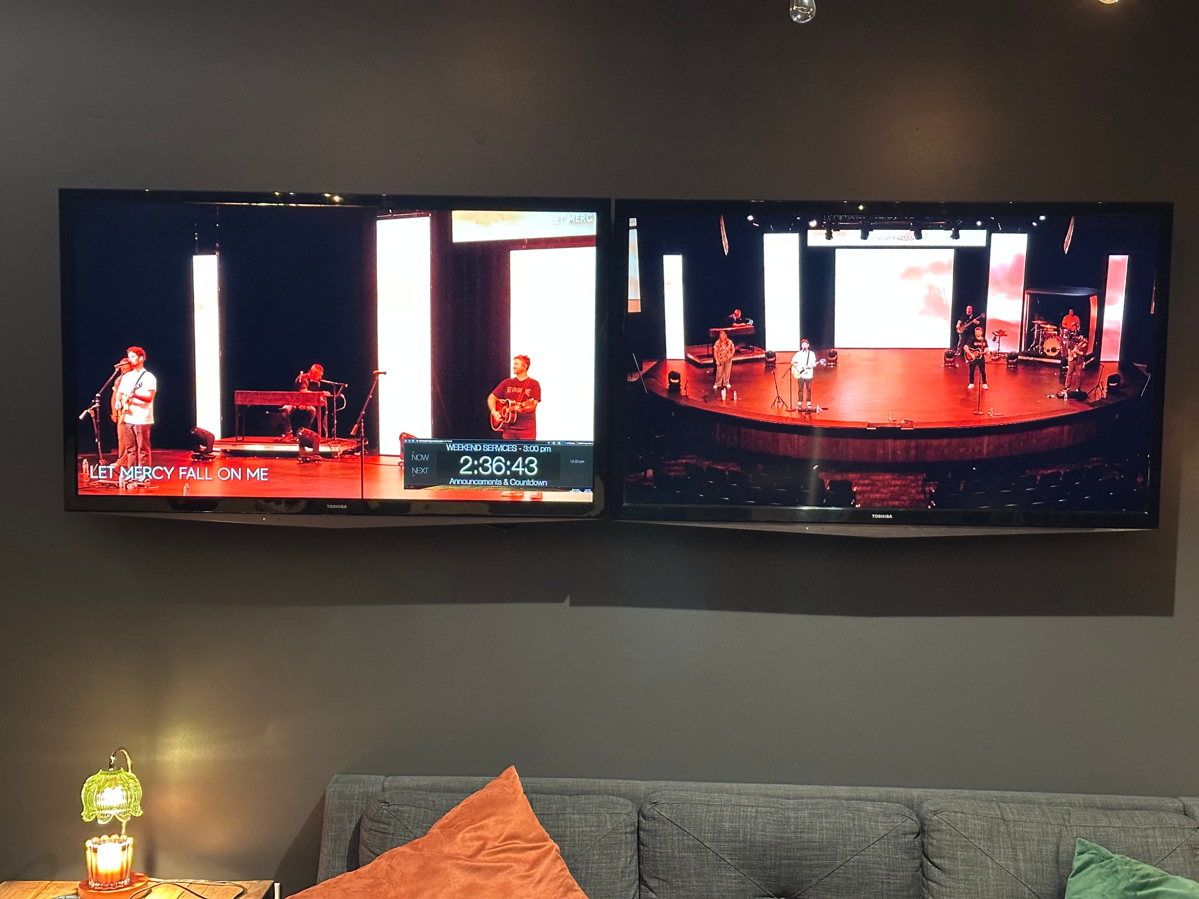 Green Room TVs showing the expected program feed and stage view